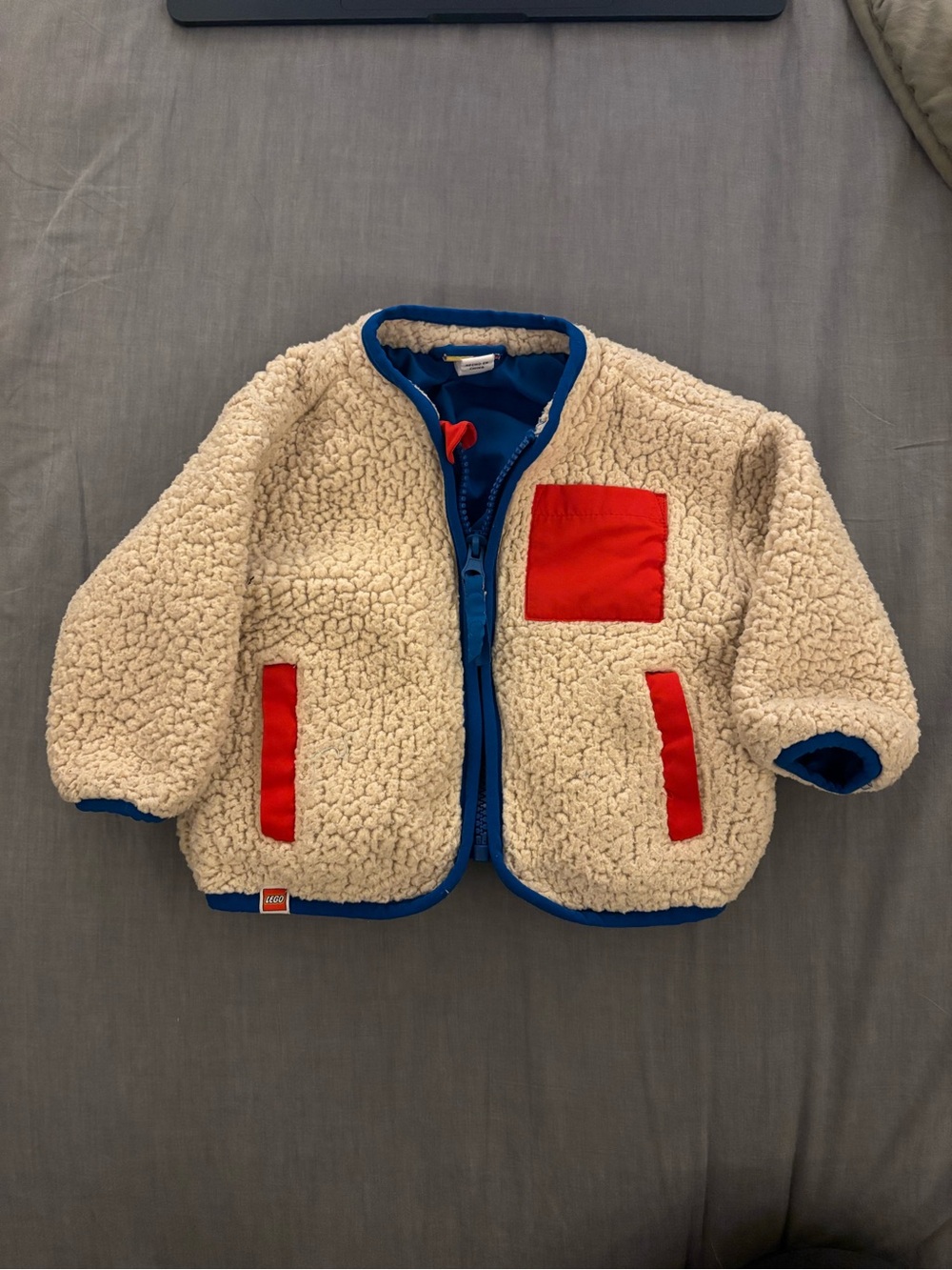 Lego Cream Sherpa Jacket with Blue Trim and Red Pocket Accents
